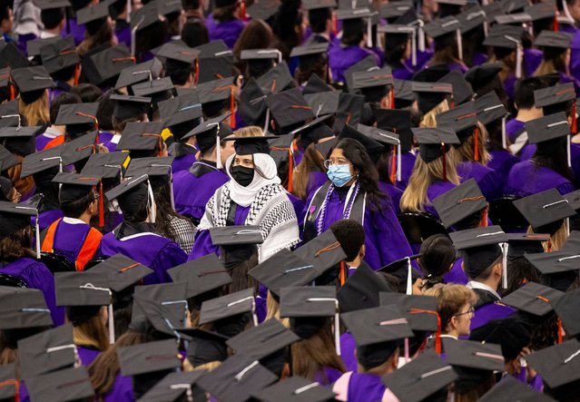 A couple of graduates silently walk out in support of Palestinians during Northwestern University's commencement, Sunday, June 9, 2024, at the United Center, in Chicago. (Photo by Brian Cassella/Chicago Tribune via AP Photo)