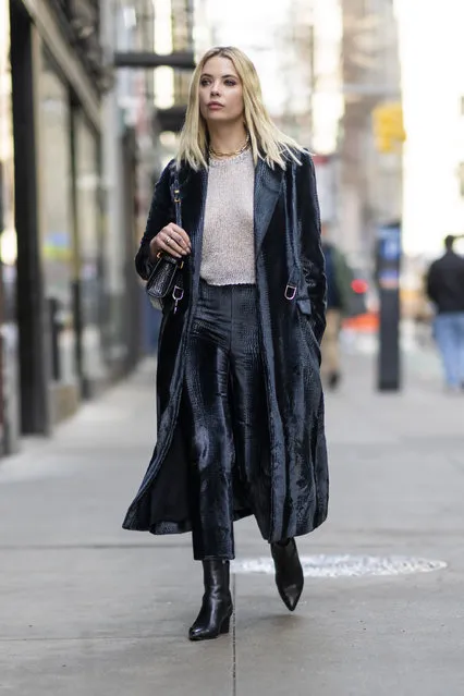 American actress Ashley Benson looks stylish while heading to a meeting in New York City on February 17, 2022. The 32 year old Pretty Little Liars alum wore a black trench coat, semi sheer sweater, black trousers, and matching boots. (Photo by The Image Direct)