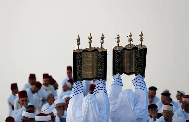 Members of the Samaritan sect take part in a traditional pilgrimage marking the holiday of Shavuot, atop Mount Gerizim, near Nablus in the Israeli-occupied West Bank on June 20, 2021. (Photo by Mohamad Torokman/Reuters)