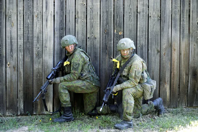 Lithuanian army soldiers attend the Spring Storm military exercise near the Estonia's eastern border in Rapina, Estonia, May 13, 2016. (Photo by Ints Kalnins/Reuters)