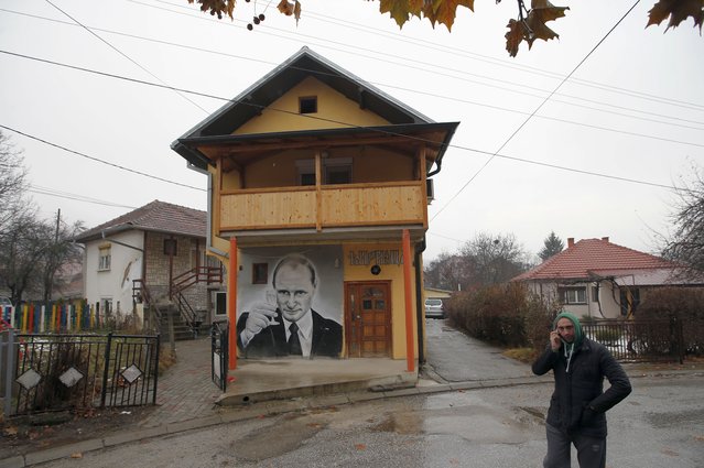 A man walks past a mural depicting Vladimir Putin, in Zvecan, Kosovo, December 15, 2018. For some European countries watching Russia's bloody invasion of Ukraine, there are fears that they could be next. Western officials say the most vulnerable could be those who are not members of the NATO military alliance or the European Union, and thus alone and unprotected – including Ukraine’s neighbor Moldova and Russia's neighbor Georgia, both of them formerly part of the Soviet Union – along with the Balkan states of Bosnia and Kosovo. (Photo by Darko Vojinovic/AP Photo/File)