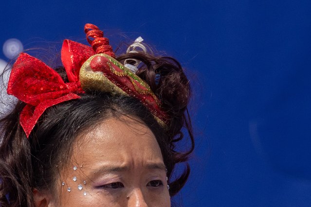 Competitors compete for the women's title at Nathan's Annual Hot Dog Eating Contest on July 4, 2024 in New York City. Sixteen-time winner Joey Chestnut is banned from this year's contest due to his partnership with Nathan's competitor Impossible Foods, which sells plant-based hot dogs. (Photo by Adam Gray/Getty Images)