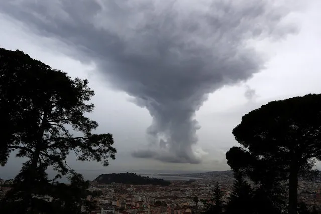 An approaching storm looming over the French riviera city of Nice, in southeastern France is pictured on April 27, 2017. (Photo by Valery Hache/AFP Photo)