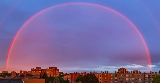 A rainbow is seen above Nagykanizsa, Hungary, Sunday, May 23, 2021, during sunset. (Photo by Gyorgy Varga/MTI via AP Photo)