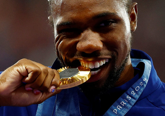 Gold medalist Noah Lyles of Team United States on the podium during the Men's 100m medal ceremony on day ten of the Olympic Games Paris 2024 at Stade de France on August 05, 2024 in Paris, France. (Photo by Sarah Meyssonnier/Reuters)