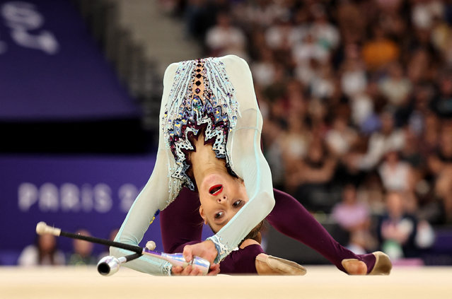 Ukraine's Taisiia Onofriichuk performs with the clubs as she competes in the rhytmic gymnastics' individual all-around qualification during the Paris 2024 Olympic Games at the Porte de la Chapelle Arena in Paris, on August 8, 2024. (Photo by Mike Blake/Reuters)