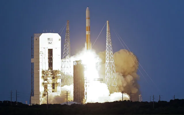 A United Launch Alliance Delta 4 rocket, carrying the seventh Wideband Global SATCOM military communications satellite, lifts off from launch complex 37 at the Cape Canaveral Air Force Station, Thursday, July 23, 2015, in Cape Canaveral, Fla. (Photo by John Raoux/AP Photo)