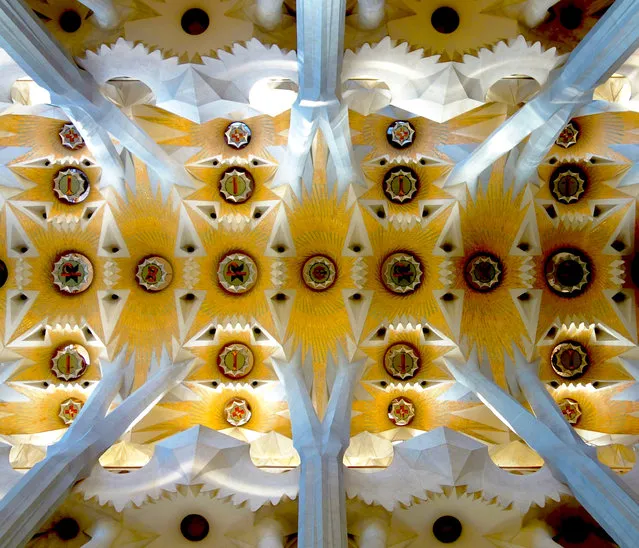 “Inside Barcelona”. I was inside the Temple of Sagrada Familia – one of the approximately 3 million visitors to the church each year. Several “trees” made me follow their trunks upward with my eyes. At the top I saw this kaleidoscope of colors that somehow grounded me. I took the same shot that I suspect many others have also taken. And yet, for each of us, because of the experience of just being there, our personal photo is truly personal. Photo location: Barcelona, Spain. (Photo and caption by Patrick Flaherty/National Geographic Photo Contest)