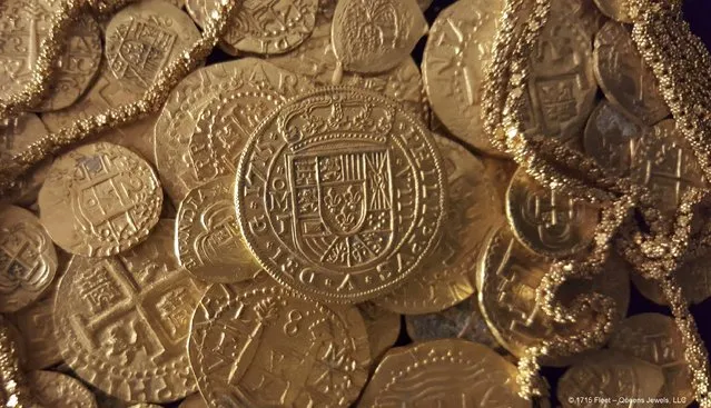 Gold coins and gold chain found in the wreckage of a 1715 Spanish fleet that sunk in the Atlantic off the Florida coast are seen in an undated handout picture courtesy of 1715 Fleet – Queens Jewels LLC. The find included 51 gold coins of various denominations, and 40 feet (12 meters) of ornate gold chain, said Brent Brisben, whose company owns the rights to the wreckage. (Photo by Reuters/1715 Fleet – Queens Jewels LLC)