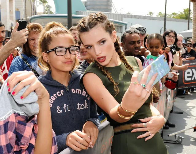 Bella Thorne takes a selfie with fans at “Extra” at Universal Studios Hollywood on June 7, 2016 in Universal City, California. (Photo by Noel Vasquez/Getty Images)