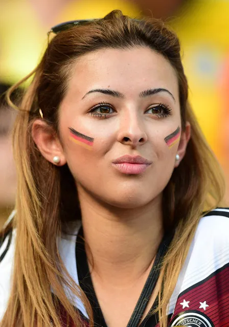 A German fan waits for the start of the Group G football match between Germany and Ghana at the Castelao Stadium in Fortaleza during the 2014 FIFA World Cup on June 21, 2014. (Photo by Javier Soriano/AFP Photo)