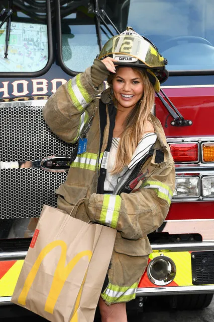 Chrissy Teigen shares McDelivery with the Hoboken Fire Department on July 25, 2017 in Hoboken City. (Photo by Dave Kotinsky/Getty Images for McDonald's)