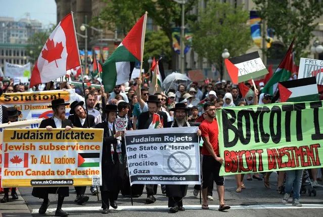 Demonstrators, including anti-Zionist Ultra-Orthodox Jews, protest in Ottawa on Tuesday, July 22, 2014. (Photo by Sean Kilpatrick/AP Photo/The Canadian Press)
