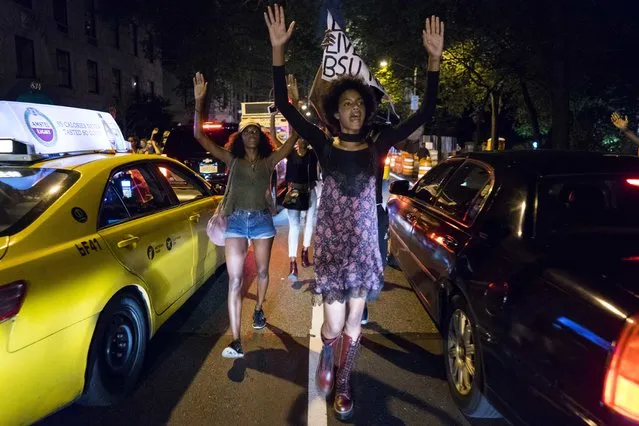 Protesters march along 5th Ave. in the Manhattan borough of New York Thursday, July 7, 2016, in the wake of the shooting deaths of Philando Castile Wednesday night in Falcon Heights, Minn. after a traffic stop by St. Anthony police, and the death of Alton Sterling, who was shot by Baton Rouge police in Baton Rouge, La., while being detained earlier this week. (Photo by Craig Ruttle/AP Photo)
