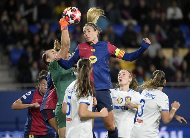 Barcelona's Spanish midfielder #11 Alexia Putellas heads the ball next to with St. Polten's goalkeeper #33 Carina Schluter during the UEFA Women's Champions League preliminary round 1 day 3 Group D football match between FC Barcelona and SKN St. Polten at the Estadi Johan Cruyff in Barcelona on November 12, 2024. (Photo by Josep Lago/AFP Photo)