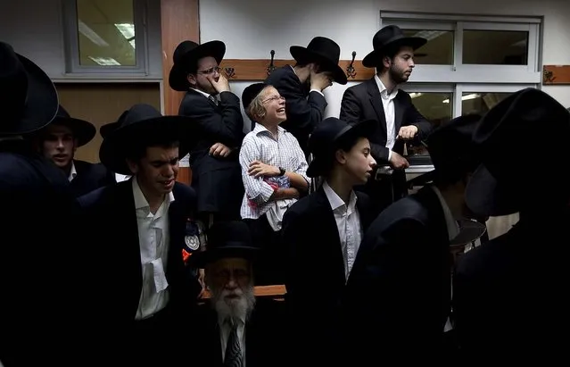 Ultra Orthodox Jews attend the funeral of Rabbi Yosef Shalom Elyashiv in Jerusalem on July 18, 2012. (Photo by Sebastian Scheiner/Associated Press)