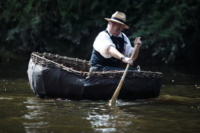 Coracler Conwy Richards from Norfolk takes part in the Ironbridge Coracle Regatta on the River Severn in his Irish River Boyne Coracle on August 28, 2017 in Ironbridge, United Kingdom. A coracle is a small boat made from an interwoven wooden frame and is used traditionally for fishing or transportation. The 30th annual Ironbridge Coracle Regatta is held today at the Ironbridge Rowing Club and sees dozens of coraclers take part in a series of races and events on the Severn. (Photo by Jack Taylor/Getty Images)
