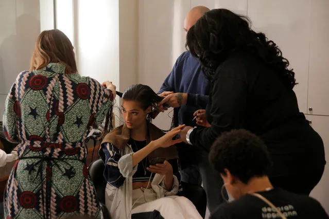 A model is prepared backstage before walking in the Brandon Maxwell Spring/Summer 2018 collection presentation at New York Fashion Week in Manhattan, New York, U.S., September 8, 2017. (Photo by Andrew Kelly/Reuters)