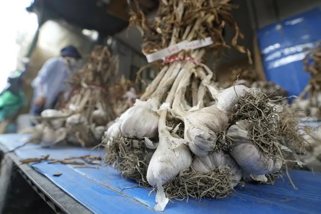 Bulbs of garlic are displayed at a shop in a traditional market in Seoul, South Korea, Wednesday, August 3, 2022. A rural South Korean town is hot water over its video ad on garlic that some farmers say is obscene and has even sexually objectified the agricultural product. (Photo by Ahn Young-joon/AP Photo)