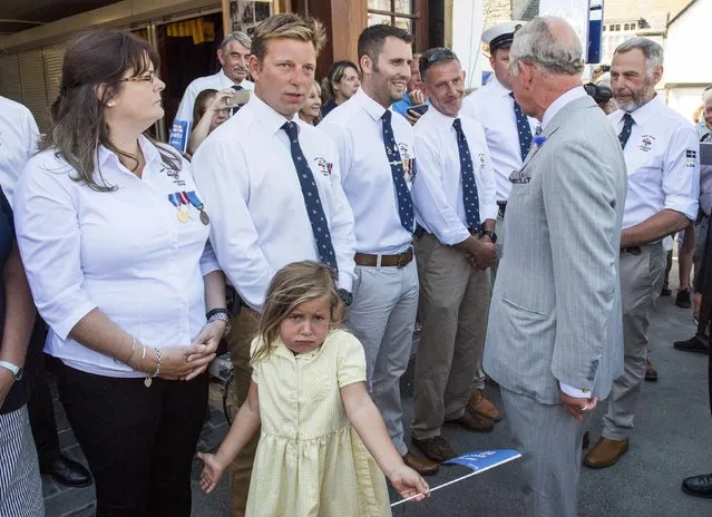 A girl reacts as Britain's Prince Charles greets well wishers during a visit to the village of Port Isaac in Cornwall, July 19, 2016. (Photo by Arthur Edwards/Reuters)