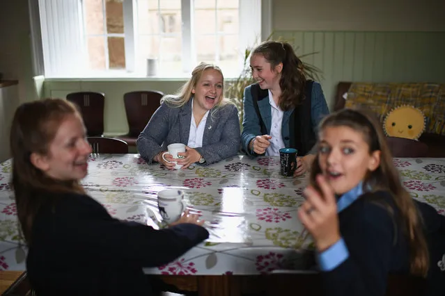 School girls arrive at Glenalmond College for the first day of term on September 5, 2017 in Glenalmond, Scotland. For the first time in one hundred and seventy years, girls will be boarding in the Gothic Front Quad of Glenalmond which has been until now a purely male preserve. Girls have boarded at the school since 1991 but until today accommodated in purpose-built boarding houses away from the historic Quad. The independent boarding school founded by William Gladstone and James Hope Scott is based on the architecture of Oxford University. (Photo by Jeff J. Mitchell/Getty Images)
