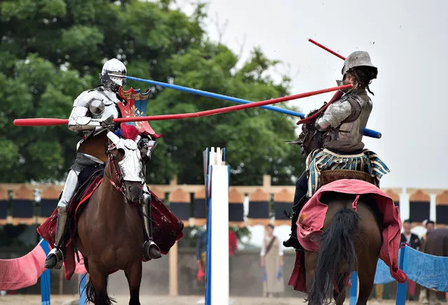 Two knights charge each other with lances in a tournament during the European Championship in Knight Joust at the Spoettrup medieval castle in Denmark, July 25, 2016. (Photo by Henning Bagger/Reuters/Scanpix Denmark)