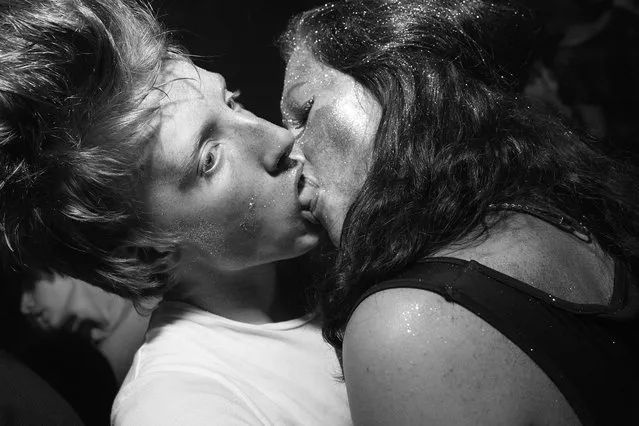 Partygoers kiss at a club in St. Petersburg, Russia, 2010. (Photo by Alexander Lepeshkin)