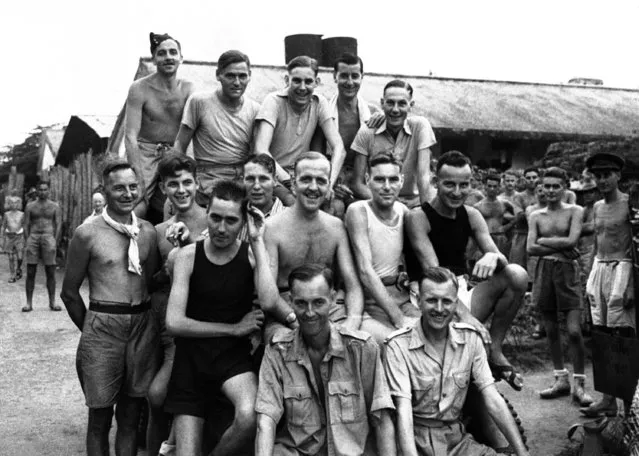 Fourteen men of No. 242 fighter squadron, known as the Remnants of the Java Wing, who were captured by the Japanese and interned in Changri Prison Camp at Singapore, on September 22, 1945. Front row seated left to right : Flying Officer Donald McIntyre and Flying officer Reginald Gibbs. Middle row: Leading Aircraftman J. Forey, Leading Aircraftman Laurence Field, Leading Aircraftman John Shepherd, Leading Aircraftman Raymond Collett, Sergeant David McGruer, Aircraftman James Tear, Leading Aircraftman P. Higgins. Back row; Aircraftman Jock Smith, Aircraftman A. Scotcher, Corporal Charles Banham, Corporal P.J. Bantham, Corporal Dick Atkins. (Photo by AP Photo)