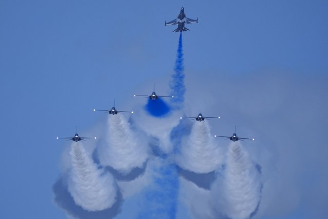 South Korean Air Force's Black Eagles aerobatic team performs during the first day of the Singapore Airshow in Singapore, Tuesday, February 20, 2024. (Photo by Vincent Thian/AP Photo)