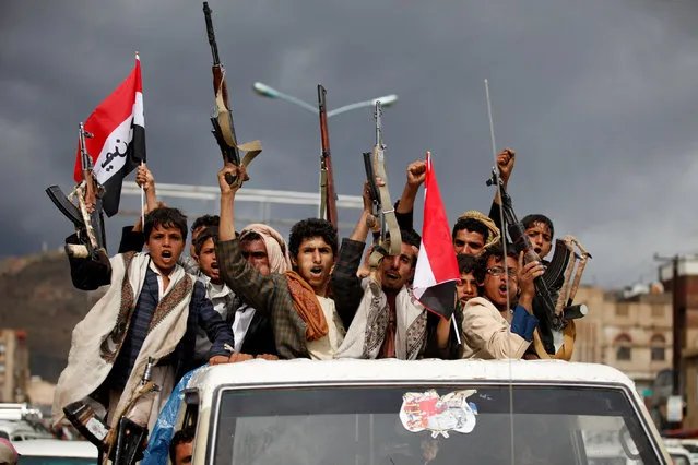 Armed men ride on the back of a truck to attend a rally held by supporters of Houthi rebels and Yemen's former president Ali Abdullah Saleh to celebrate an agreement reached by Saleh and the Houthis to form a political council to unilaterally rule the country, in Sanaa, Yemen August 1, 2016. (Photo by Khaled Abdullah/Reuters)