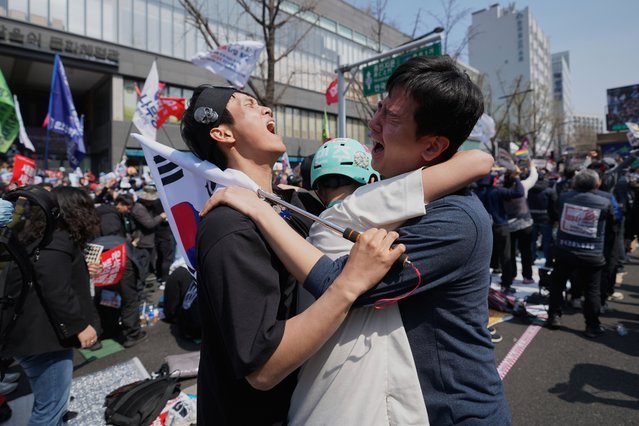 People react after hearing the news that President Yoon Suk Yeol was removed from office, in Seoul, South Korea, Friday, April 4, 2025. (Photo by Lee Jin-man/AP Photo)