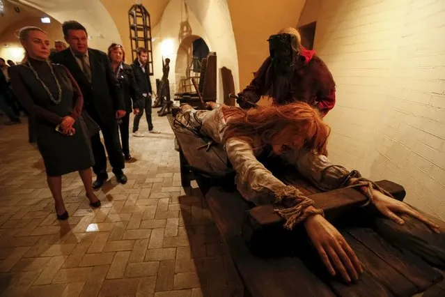 People visit the exhibition titled "Medieval Executions and Punishments" in Kiev, Ukraine, October 7, 2015. (Photo by Valentyn Ogirenko/Reuters)