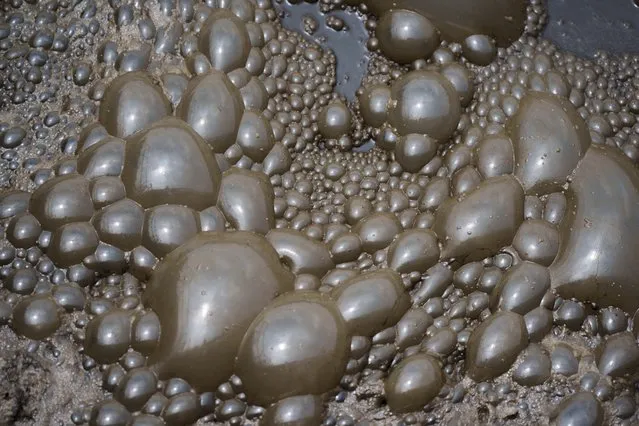 Bubbles form from the polluted water of the Bagmati River as it is processed at the Guheswori Wastewater Treatment Plant before it reaches the Pashupatinath Temple in Kathmandu, Nepal, Friday, June 3, 2022. (Photo by Niranjan Shrestha/AP Photo)