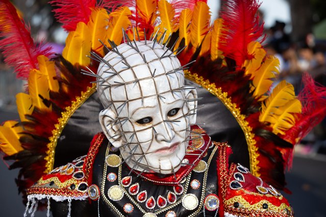 A troupe member participates in the National District Carnival in Santo Domingo, Dominican Republic, 03 March 2024. The carnival, organized by the Mayor's Office of Santo Domingo, was attended by some 80 members of troupe members and individuals. The cultural expressions' outstanding presence highlighted the festival's richness and creativity. (Photo by Orlando Barria/EPA/EFE)