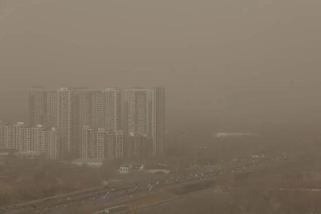 A general view of the skyline in the sandstorm on February 28, 2013 in Beijing, China. Beijing was hit by its first sandstorm of the year while its air quality reached dangerous level on Thursday.  (Photo by Feng Li)