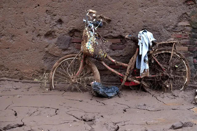 A bicycle is seen covered in debris following a flash flood this week which killed more than 20 people in Garut, West Java,  Indonesia September 23, 2016. (Photo by Wahyu Putro A./Reuters/Antara Foto)