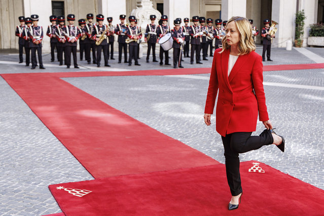 Italian Premier Giorgia Meloni adjusts her trousers ahead of her meeting with Czech Republic's Prime Minister Petr Fiala, at Palazzo Chigi's premier office in Rome, Monday, May 13, 2024. (Photo by Roberto Monaldo/LaPresse via AP Photo)