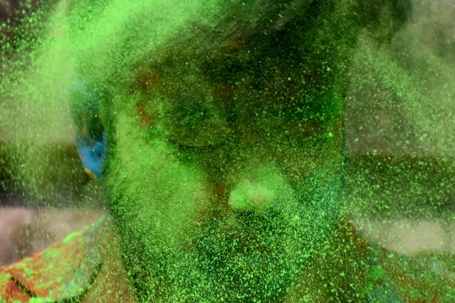 A person is playing with colour powder on the occasion of Holi in Kolkata, India on 07 March 2023. (Photo by Sudipta Das/NurPhoto via Getty Images)