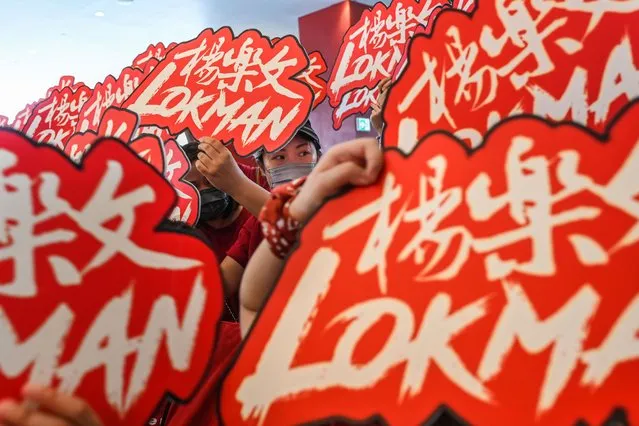 Fans of Lokman Yeung, a member of Hong Kong boy band “Mirror”, react during the 16th Asian Film Awards red carpet prior to the Ceremony of the Awards, at Hong Kong Palace Museum, in Hong Kong, Sunday, on March 12, 2023. The post-Covid edition of the Asian Film Awards is taking place at Hong Kong Palace Museum for the first time that the Asian showbiz event is held in Hong Kong since Covid hit the city in 2020. (Photo by Billy H.C. Kwok/AP Photo)