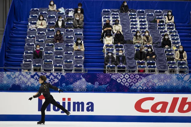 Spectators watch Sena Miyake of Japan warm up during a practice session of an ISU Grand Prix of Figure Skating competition in Kadoma near Osaka, Japan, Friday, November 27, 2020. The event was held with limited spectator attendance Friday. (Photo by Hiro Komae/AP Photo)