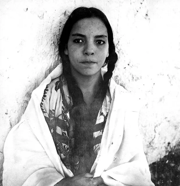 A 1960 photograph of an Algerian woman in a French regroupment village. (Photo by Marc Garanger)