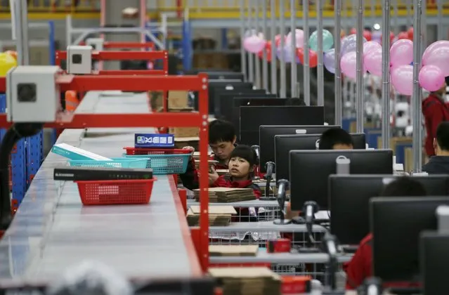 Employees work at a JD.com logistic centre in Langfang, Hebei province, November 10, 2015. (Photo by Jason Lee/Reuters)
