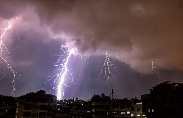 Lightning strikes is seen in the sky over Gaza city during a rainstorm on November 1, 2020. (Photo by APA Images/Rex Features/Shutterstock)