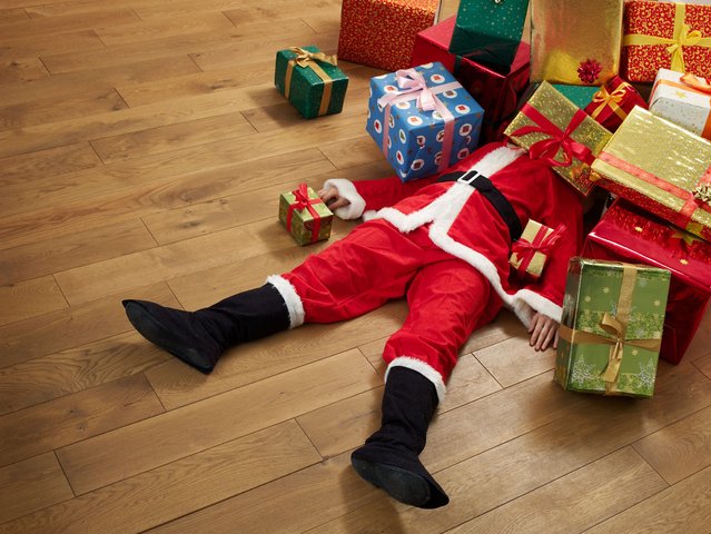 Santa Claus and presents – stock photo. (Photo by Kai Wiechmann/Getty Images)
