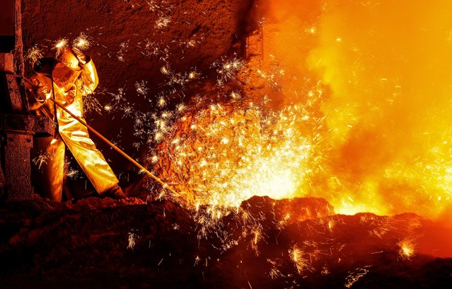A steel worker at blast furnace 2 of German corporation ThyssenKrupp in Duisburg, Germany, 22 October 2025. Thyssenkrupp is an international industrial and technology group with its business activities bundled in five segments: Automotive Technology, Decarbon Technologies, Materials Services, Steel Europe and Marine Systems. (Photo by Friedemann Vogel/EPA)