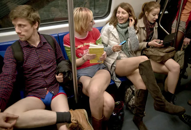 Youngsters ride on a train as they take part in the first edition of the No Pants Subway Ride in Bucharest, Romania, Sunday, January 11, 2015. (Photo by Vadim Ghirda/AP Photo)