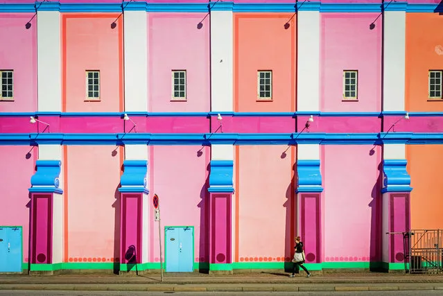 “Neon”. A young woman passes by the Palads theatre in Copenhagen, Denmark. (Photo and caption by Marcin Mokrzewski/National Geographic Traveler Photo Contest)
