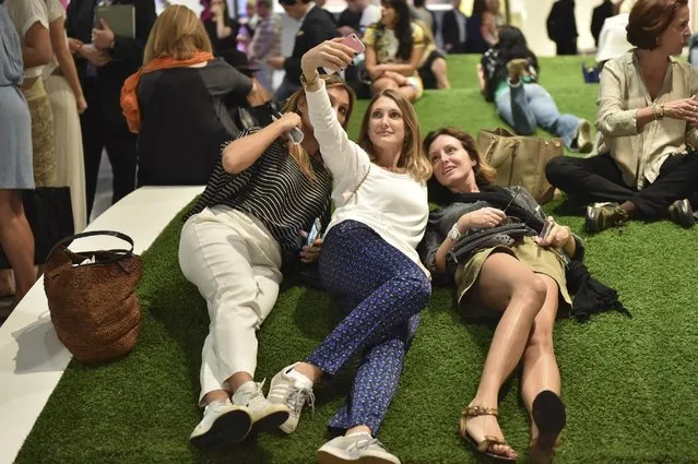 Attendees relax on the AstroTurf at the Art Basel Miami Beach - VIP Preview at the Miami Beach Convention Center on December 2, 2015 in Miami Beach, Florida. (Photo by Mike Coppola/Getty Images)