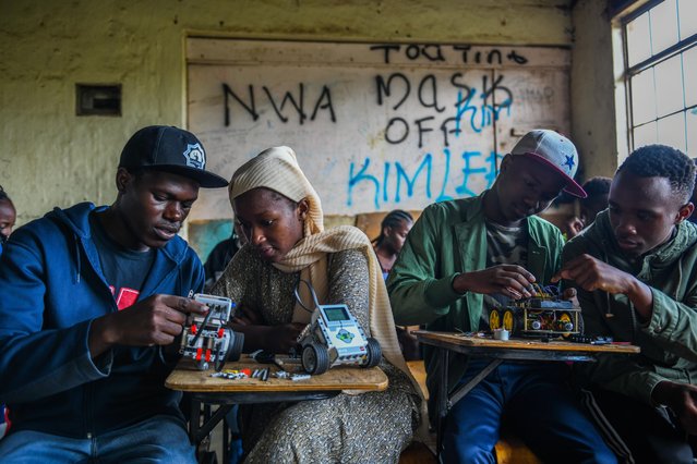 Young people, living in Mathare slum, learn future technologies at a robotics and coding workshop in Nairobi, Kenya on May 11, 2023. Because of the trainings provided by the Oasis Mathare Institution, young people in Mathare, where impoverished families reside, have a brighter future. (Photo by Gerald Anderson/Anadolu Agency via Getty Images)