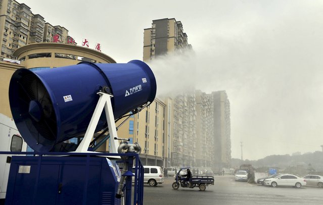 A "mist cannon" works alongside a street on a smoggy day in Changsha, Hunan province, China, December 8, 2015. (Photo by Reuters/Stringer)